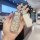 Elegant aion y plus key cover with sparkling design, featuring a sleek silver finish and a decorative charm, perfect for aion...