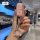 A hand holds a pink, glittery land rover jaguar key cover with a sparkling ring and black strap, showcasing its elegant desig...