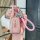 A hand holds a pink toyota key cover for camry, corolla, rav4 & highlander, featuring a sleek design with a braided strap and...