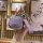 A hand holds a stylish purple jetour traveler 2024 key cover for chery shanhai t2, featuring a sleek geometric design and a g...