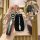 A hand holds a sleek black chevrolet key cover featuring the iconic logo, designed for cruze, malibu, and trax models, with a...