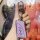 A hand holds a sleek, lavender lexus key cover for es200, es300h, rx300, and nx200 models, featuring a metallic lexus logo an...