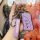 A hand holds a stylish purple lexus key cover for es200, es300h, rx300, and nx200, featuring a sleek design with a carabiner ...