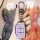 A hand holds a sleek, lavender hyundai key cover with a silver carabiner, designed for models like tucson, elantra, and sonat...