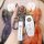 Hand holding a volkswagen touareg key fob with a white silicone cover, featuring the vw logo and functional buttons, designed...