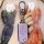 A hand holds a light purple mazda 6 key cover, featuring a sleek design with three buttons and a silver carabiner, set agains...