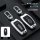 Silver and deep space black lincoln key covers for z, aviator, navigator, and more, showcasing a sleek metal buckle design wi...