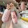 Elegant pink leather key cover for huawei aito m5, featuring a stylish bear design and crystal accents, with a back view show...