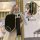 Elegant kia key cover with multi-button display, featuring a sleek black design, leather strap, and decorative f charm for ne...