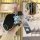 Hand holding a kia key cover 2024 tpu case with a cute bear charm and button display detail, showcasing stylish protection fo...