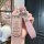 Elegant toyota rush/wigo key cover with a glittery finish, featuring a pink leather strap and a sparkling h charm for stylish...