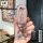 Hand holding a glittery pink perodua toyota key cover with a decorative ring, showcasing its elegant design and protective fe...