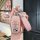 Elegant pink perodua toyota key cover with glittery finish and leather strap, offering stylish protection for your remote.
