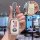 A hand holds a sleek honda key cover with a charm, showcasing its front view and button layout, designed for civic, acco...
