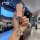A hand holds a sparkling pink xpeng x9 tpu key cover pro/max, featuring a glittery design and a decorative keychain, set agai...