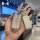 Model b roewe rx5 key cover: a hand holds a luxurious, diamond-embellished key cover with a matching leather tag, showcasing ...