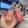 A hand holds a pink chevrolet key cover for cruze, malibu & trax, featuring a sleek design with a glittery finish and a match...