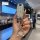 A hand holds a sleek, silver nissan key cover with a sparkling ring keychain, designed for altima, x-trail, qashqai, and more...