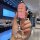 A hand holds a pink jeep key cover for compass, cherokee, and grand cherokee, featuring a glittery texture and a decorative s...