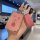 Elegant pink nfc card key cover for hongqi hs5 and hs7, featuring a sleek design with a heart-shaped charm and a leather tag ...