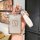 A hand holds a sleek zeekr key cover with a glittery zekr logo, paired with a white leather strap labeled fashion, designed f...