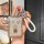 A hand holds a stylish key cover for the hongqi hs7 and hs5 models (2023-2024), featuring a metallic finish with chinese char...