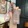 A hand holds a gac trumpchi m8 key cover, featuring a full-enclosure snap-on shell with a glittery pink design and a pink bra...