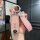 Elegant pink mazda cx-5 key cover for 2021+ models, featuring a glittery finish and a stylish fashion leather strap.