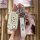 A hand holds a sleek white fiat 500 key cover, featuring a leather strap with the fiat logo and a matching keychain, designed...