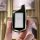 A hand holds a sleek, black starline key cover for b6/b9/a91/a96 remotes, featuring a modern design with a metallic finish an...