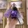 A hand holds a purple hyundai elantra or kia forte key cover with a matching bear charm and patterned strap, showcasing its s...