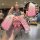 A hand holds a pink volkswagen golf 8 key cover protector with a cute bear charm, showcasing its front view and sleek design ...