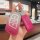 A hand holds a pink gradient chery eq1 key cover with a matching leather strap and decorative charm, designed for 2021–2022 a...