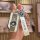 A hand holds a sleek bmw key cover with a leather strap, featuring the iconic bmw logo and designed for models like 530li, 32...