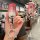 A hand holds a sleek, gradient pink buick key cover for regal 2024, lacrosse 2024, and envision s, featuring a cat-ear keycha...