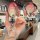 A hand holds a sleek, gradient pink xiaomi p7 key cover for xpeng vehicles, featuring a front view with a stylish cat-ear key...