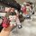 Front view of a stylish bj40 key cover for beijing auto models, featuring a red design with a cute bear charm and decorative ...