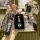 Hand holding a sleek black dongfeng fengguang 580 key cover with dfm branding, featuring a front design with a car icon and a...