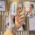 A hand holds a sleek, white xpeng p7 key cover with a premium leather finish, showcasing its front design featuring the xpeng...