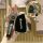 A hand holds a sleek black buick envision s/gs key cover with a premium leather strap and silver accents, showcasing the fron...