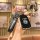Black nissan key cover with leather strap, designed for sylphy, teana, x-trail, and more, featuring a sleek front design.