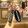Hand holding a sleek black b70 key cover for faw besturn b70 & t77 pro, featuring a good luck strap and front view of the rem...