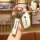 A hand holds a sleek, white roewe key cover with a metallic finish and roewe branding, featuring a matching keychain and cara...