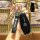 A hand holds a sleek black mg one 2022 key cover with a genuine leather strap and silver morgan branding, showcasing its fron...