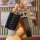 A hand holds a sleek, black tank 300 cyber key cover for wey tank300 2022+, featuring a leather strap and a decorative keycha...