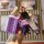 A hand holds a purple tank 300 cyber key cover with a bear-shaped charm and a matching strap, showcasing its sleek design for...