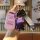 A hand holds a pink chery key cover for tiggo 8/5x/7, arrizo 5 plus & fulwin 2a3, featuring a cute purple bear charm and a st...