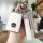 Elegant white mazda key cover with crystal accents and a leather strap, designed for models like axela, cx-30, cx-5, cx-4, an...