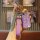 A hand holds a stylish purple tiejiangjun key cover with a quilted strap and a decorative h charm, designed for 6031/3930/661...