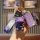 A hand holds a purple tiejiangjun key cover with a cute bear charm, featuring a gradient strap and a sleek design for keys li...